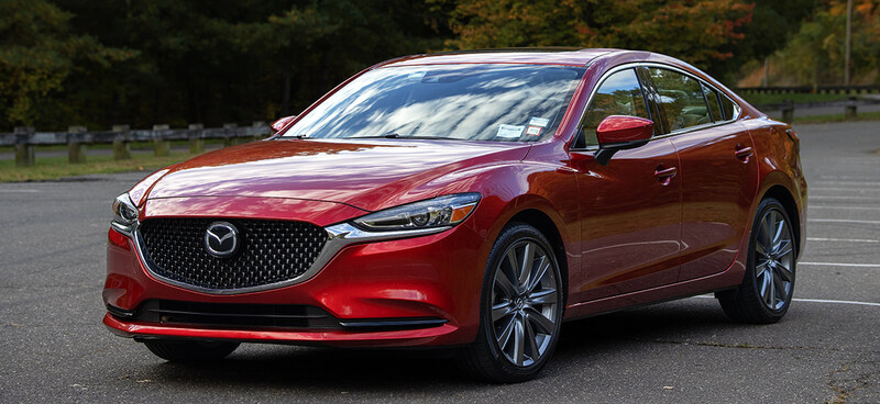 AI was used to remove the front license plate from this Mazda.