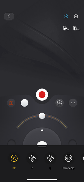 Screenshot of a camera app interface with circular control dials and white adjustment indicators on dark background.