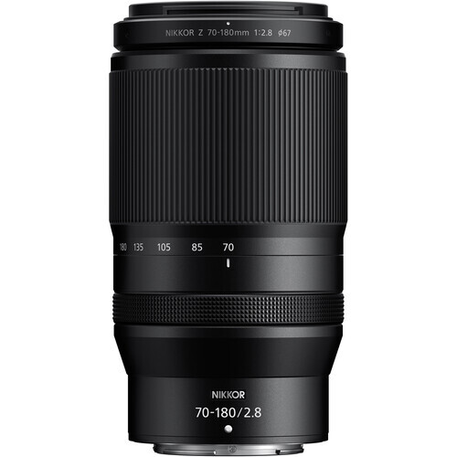Nikon Z 70-180mm f/2.8 telephoto lens with ribbed barrel and focus ring against white background.