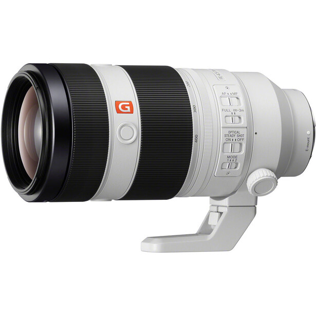 Sony E-mount telephoto zoom lens with white and black barrel, featuring manual focus ring and depth-of-field markings.
