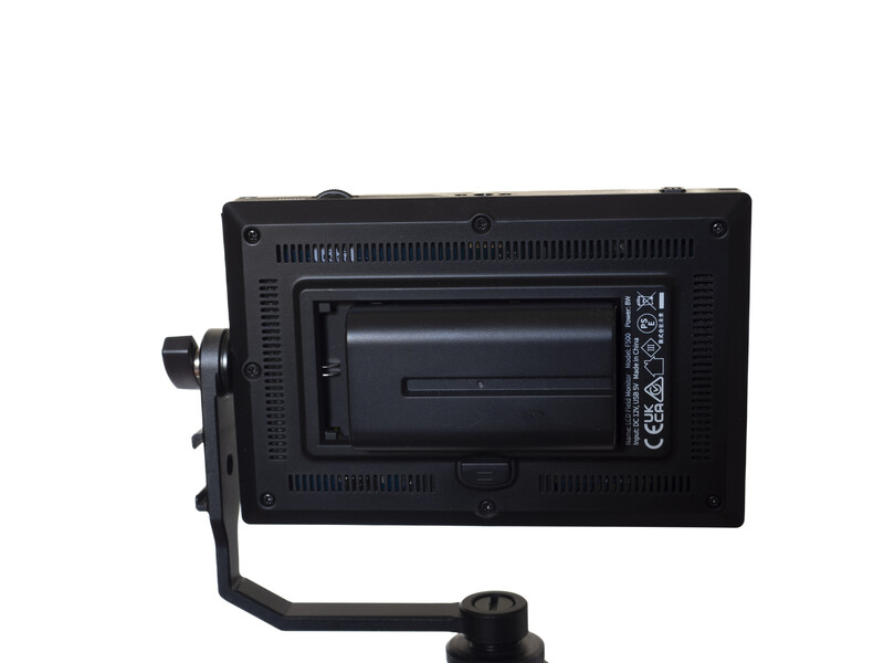 Rear view of a professional LED panel light with battery slot and mounting bracket.