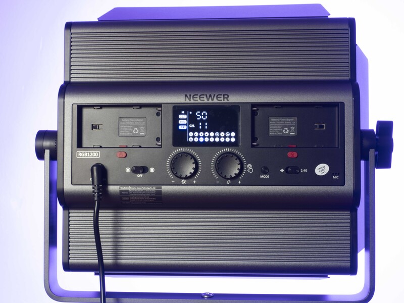 Neewer LED panel light with purple frame and horizontal ribbed diffuser panel.