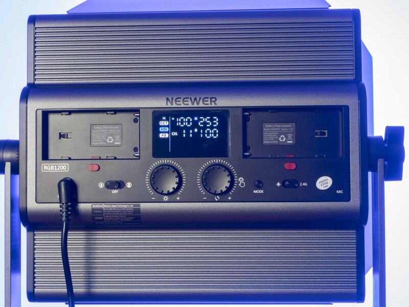 Neewer brand studio light with blue housing, digital display panel, and control knobs.