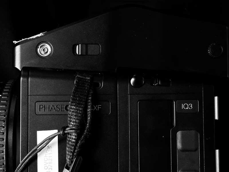 Close-up view of a medium format camera's top and side panels in black and white.