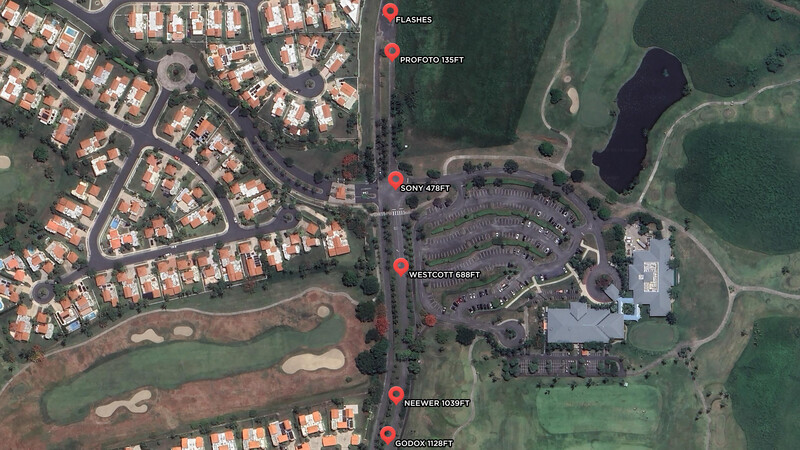 Aerial map view showing suburban residential development adjacent to commercial parking area and golf course.