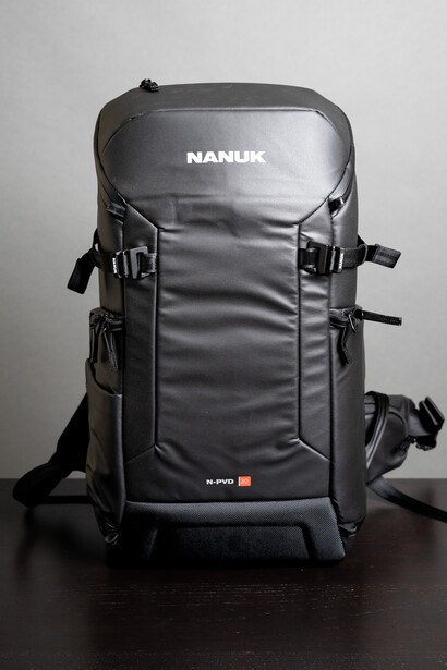 Nanuk hard camera backpack with padded compartments and attachment straps, displayed against a neutral background.