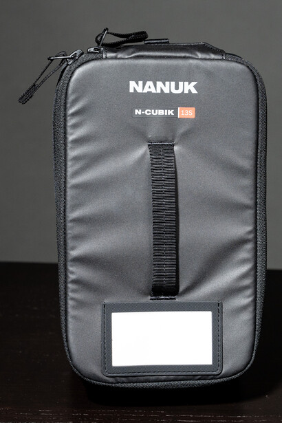 Nanuk N-Cubik gray protective carrying case with black zipper and ID label pocket.