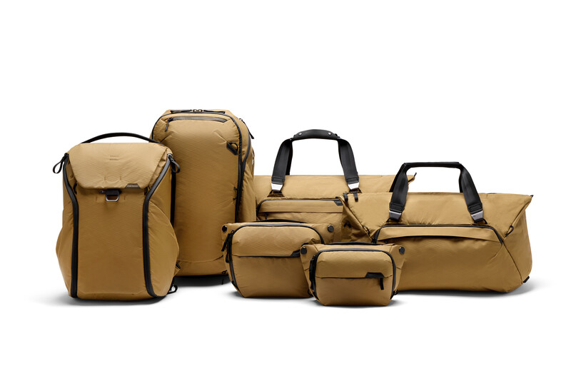 Collection of six tan camera bags and cases in various sizes arranged against a white background.
