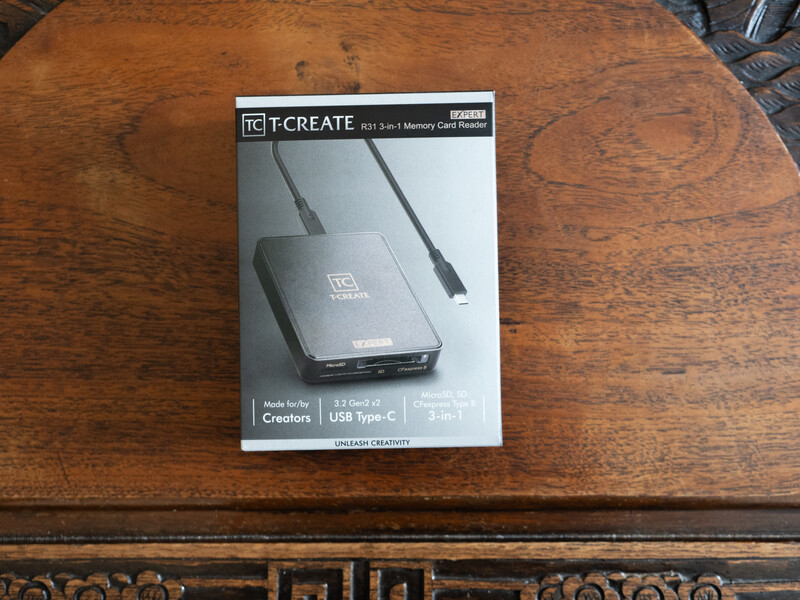 TC Create USB Type-C hub with cables on wooden surface.