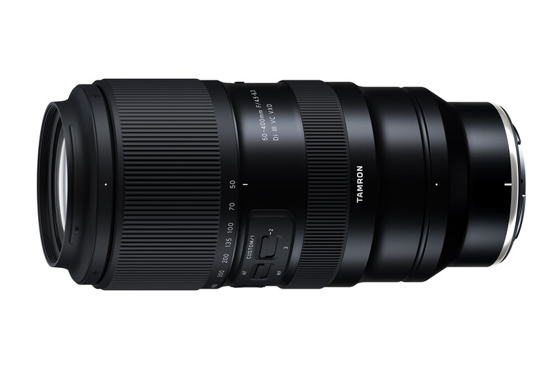 Tamron telephoto zoom lens with black barrel and ribbed focus ring, shown in product view against white background.