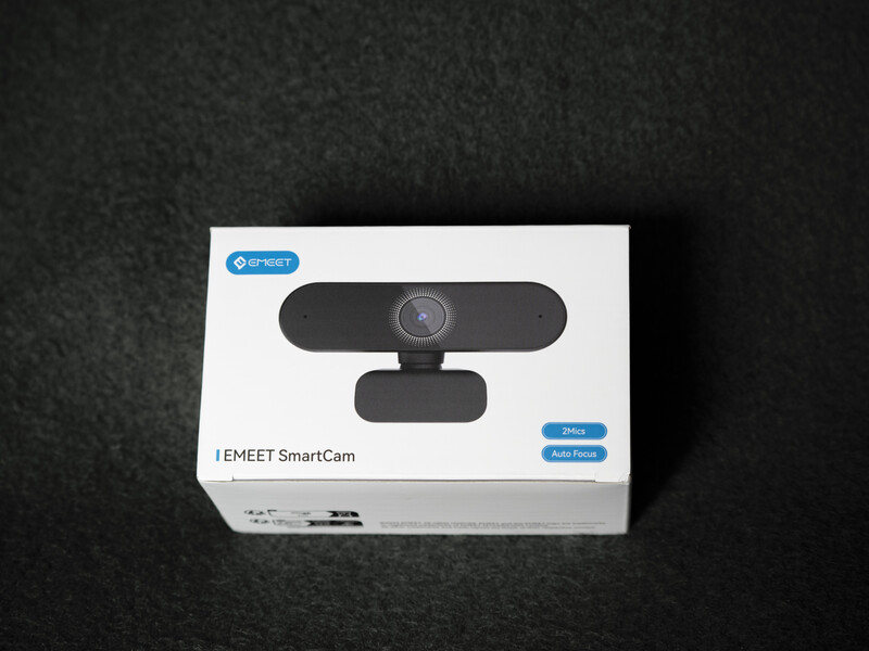 IEMEET SmartCam webcam in retail packaging against a textured dark background.