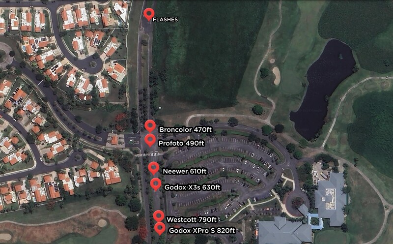 Aerial map showing camera equipment locations marked with red pins near a parking lot and forested area.
