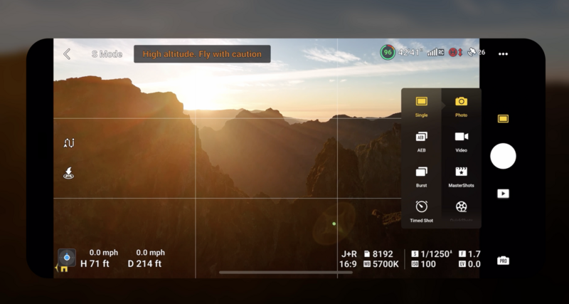 Screenshot of drone camera interface displaying canyon landscape at sunset with flight telemetry data.