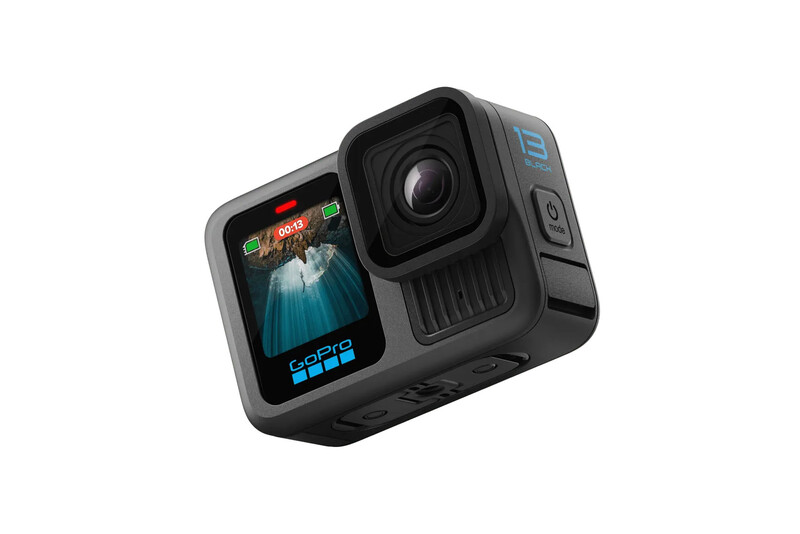 Rugged action camera with flip-out touchscreen display and mounted lens on white background.