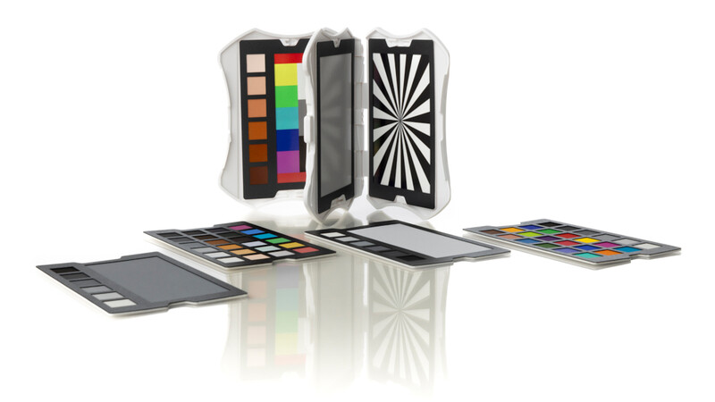 Color checker reference card and calibration charts displayed with folded case showing color swatches and geometric patterns.
