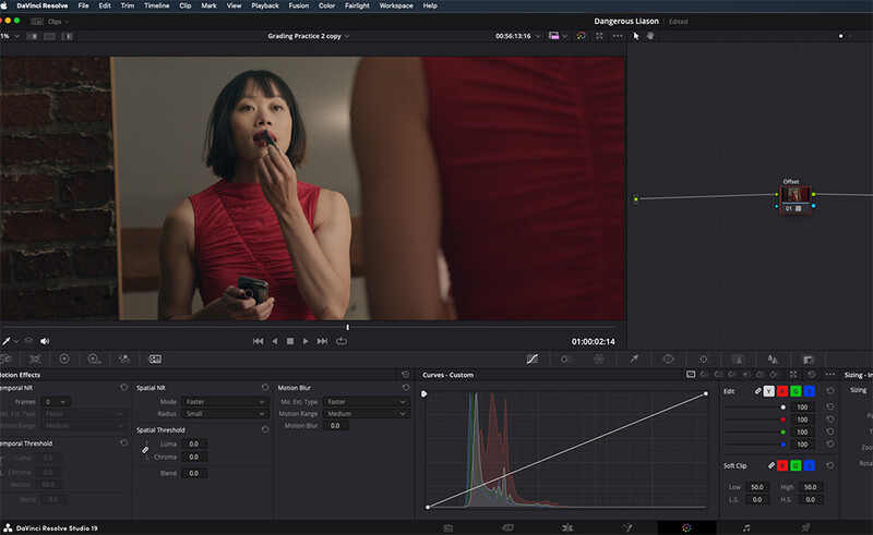 Screenshot of video editing software showing a woman in a red sleeveless top with color grading adjustments applied.