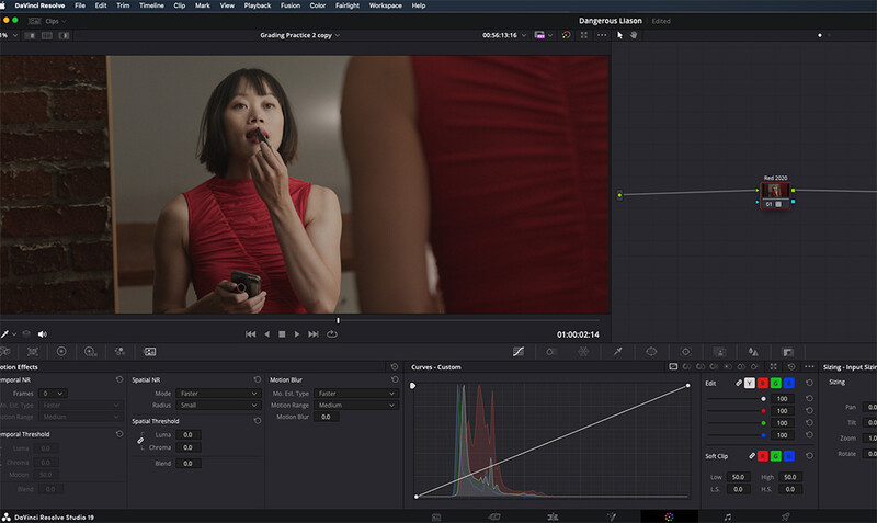 Screenshot of video editing software showing color grading interface with histogram and a woman in red dress.