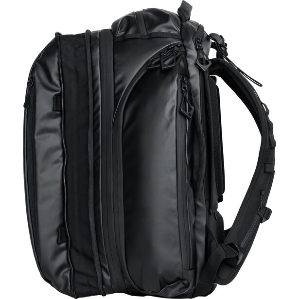 Black camera backpack photographed against white background, showing front panel with multiple compartments and padded shoulder straps.