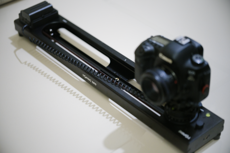 Black camera viewfinder assembly with magnified eyepiece and textured white base plate.