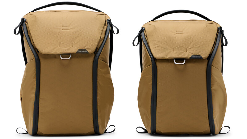 Side-by-side comparison of two tan and black camera backpacks in different sizes.