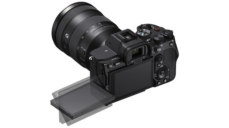 Mirrorless camera with attached zoom lens and articulating LCD screen extended downward.