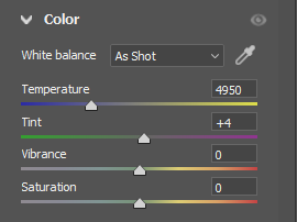 Screenshot of color grading panel showing white balance, temperature, tint, vibrance, and saturation sliders.