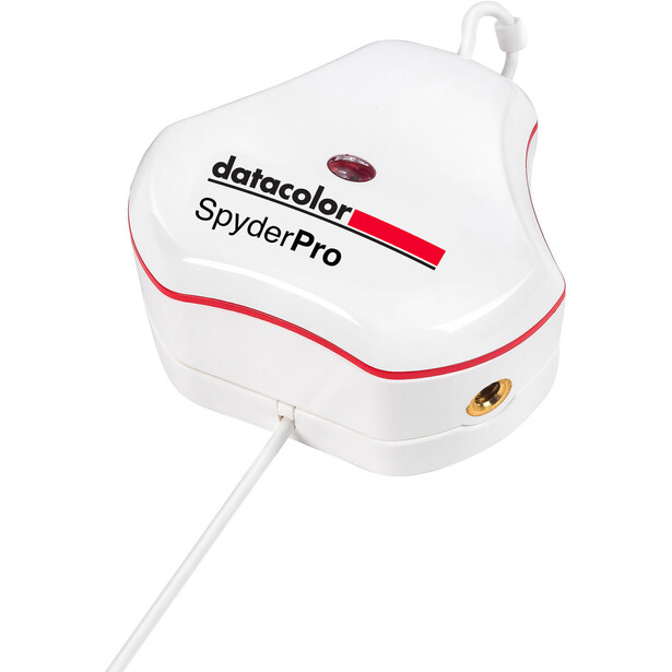 Datacolor SpyderPro color calibration device with white housing and attached USB cable.