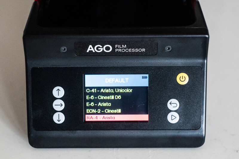 AGO Film Processor device with LCD screen displaying default film processing options and menu controls.