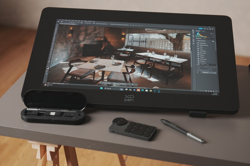 XP-Pen tablet displaying 3D architectural rendering in editing software with stylus and wireless mouse nearby.