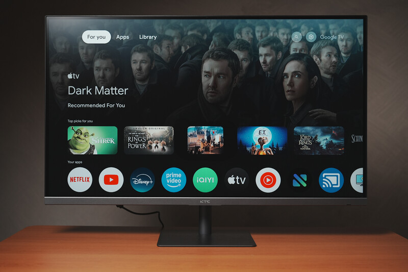 Screenshot of Apple TV interface displaying Dark Matter series recommendation with streaming service app icons below.
