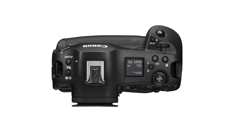 Top-down view of a professional mirrorless camera body with flash hot shoe and control dials.