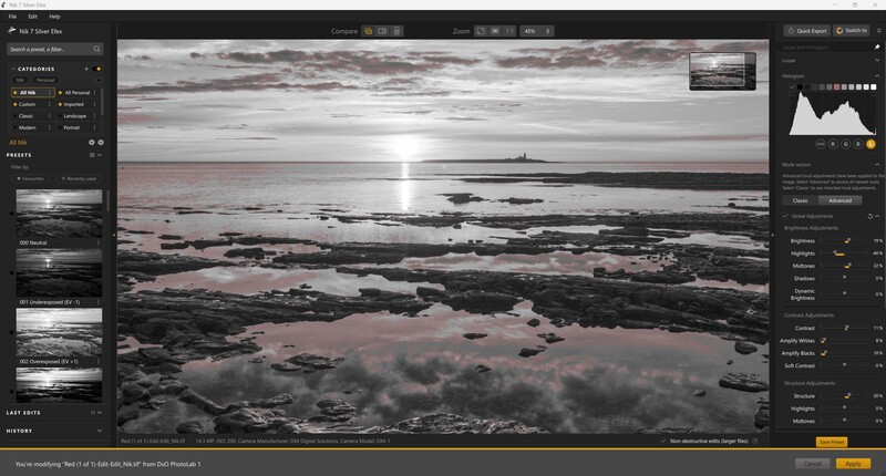 Screenshot of photo editing software displaying a moody coastal landscape with pink and gray tones.