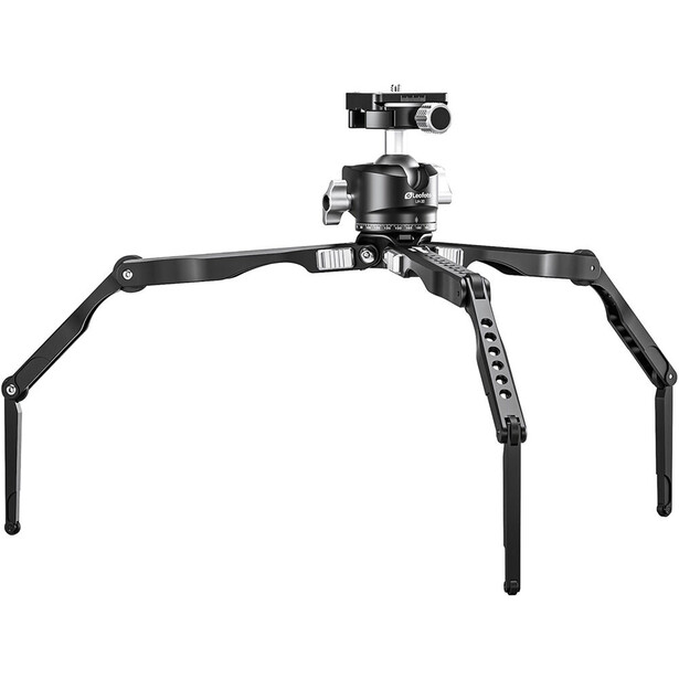 Spider-legged camera tripod with ball head and small camera mounted on top.