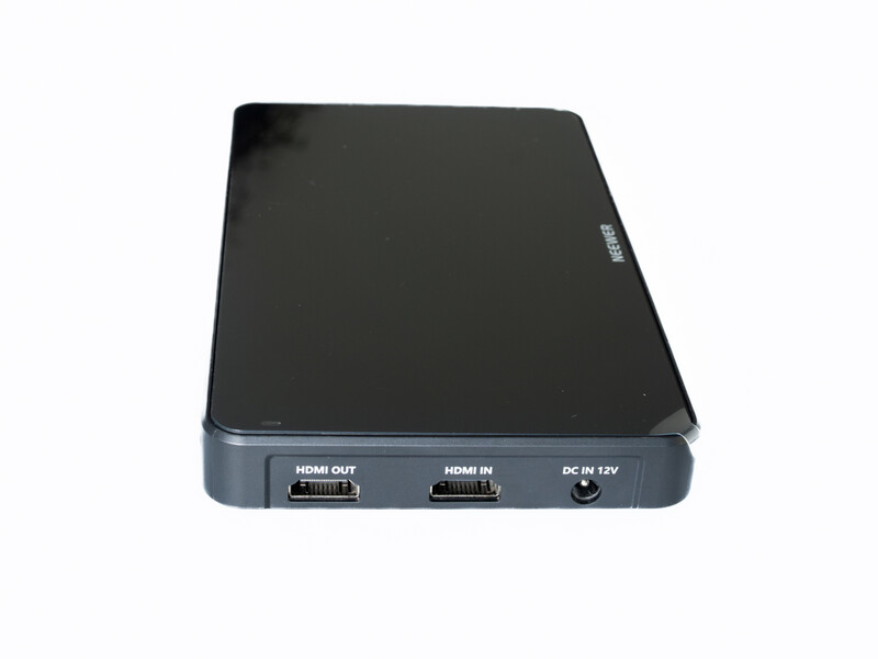 Compact external device with two HDMI ports and DC power input on the rear connector panel.