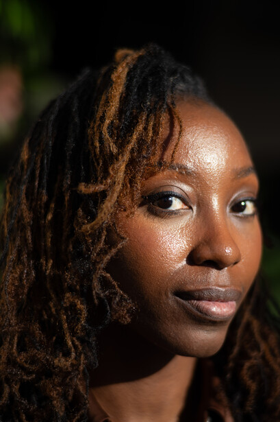Close up photograph of black woman with dreadlocks