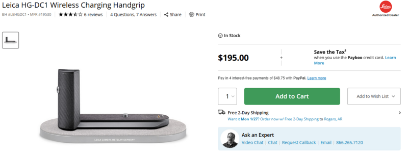 Leica HG-DC1 wireless charging handgrip displayed on a light gray platform with its cylindrical charging case.