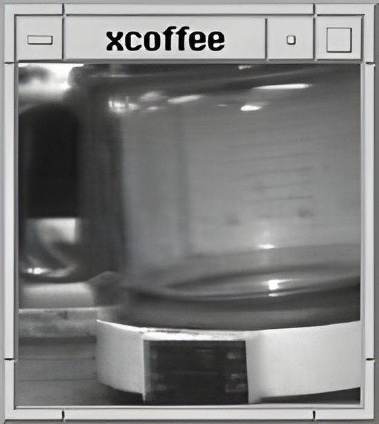 Black and white photograph of a coffee mug with blurred background and reflective surfaces.