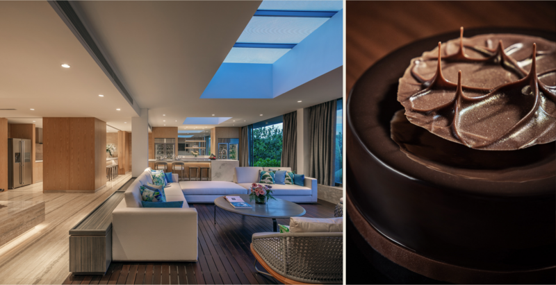 Modern luxury living room with skylight, blue sofa, and chocolate dessert plated on dark ceramic.