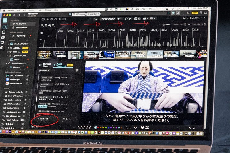 Screenshot of video editing software displaying a timeline with audio waveforms and a preview of a seated figure in a blue-toned composition.
