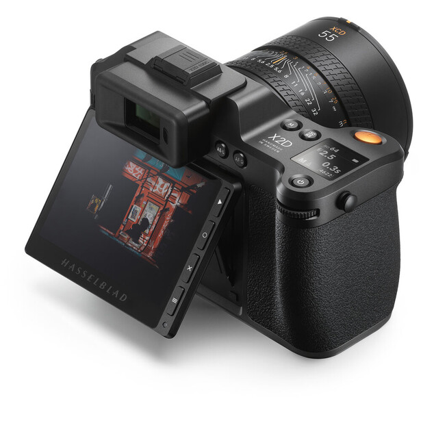 Mirrorless camera with articulating LCD screen and telephoto lens attached, displayed against white background.