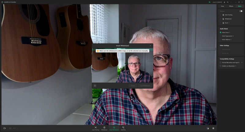 Screenshot of video conferencing interface showing man with glasses in plaid shirt during live stream or video call.