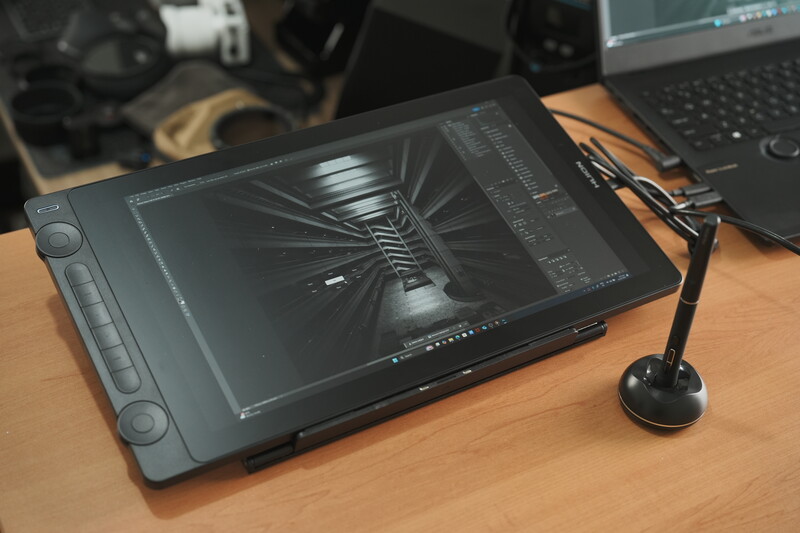 Pen display tablet showing architectural perspective rendering in design software.