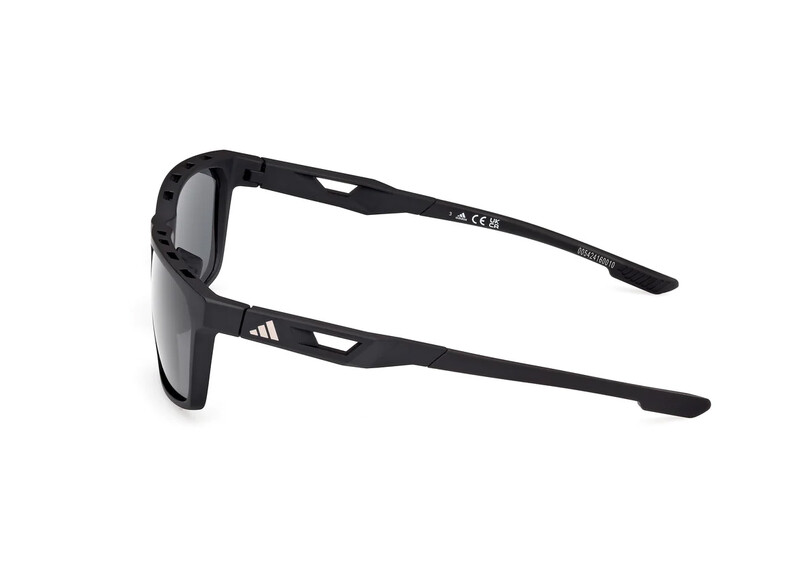 Black wraparound sunglasses with dark lenses shown from a side angle against a white background.
