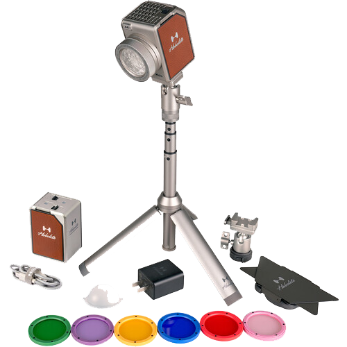 Product photography lighting kit with flash head, stand, power pack, and color filters displayed.