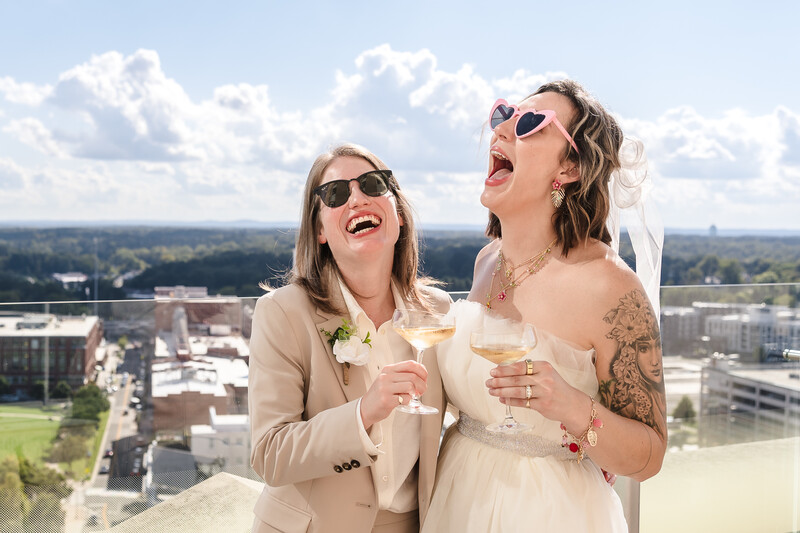 Couple laughs in hard light portrait photography example