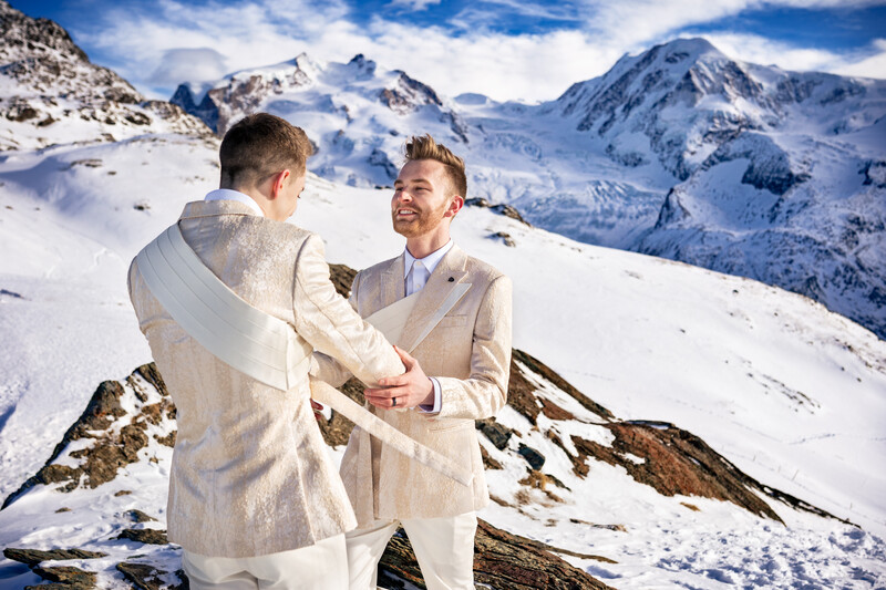 Newlyweds embrace one another in front of the Matterhorn