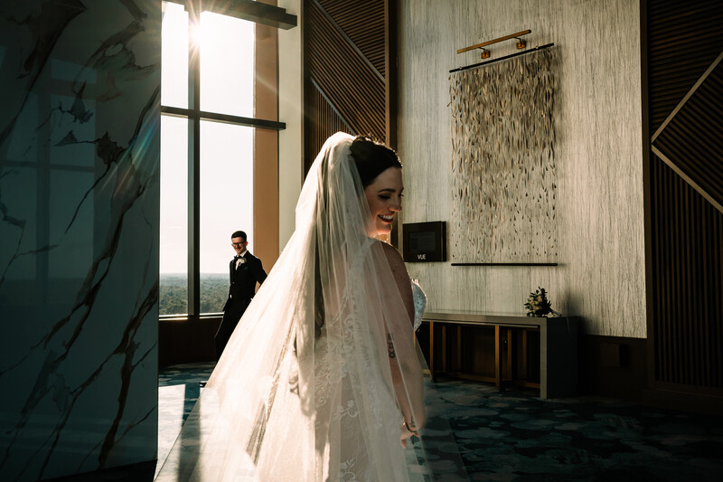 Couple stands in lobby