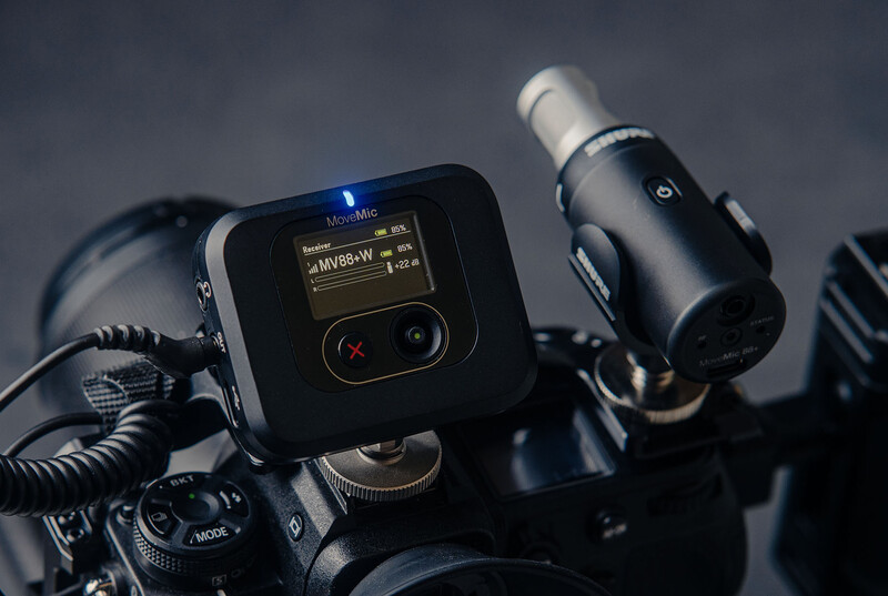 Professional video monitoring equipment mounted on camera rig with small display screen and external recorder.