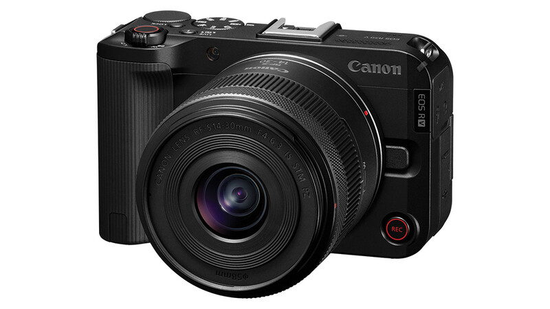 Canon EOS R50 mirrorless camera with RF-mount lens attached, displayed against white background.