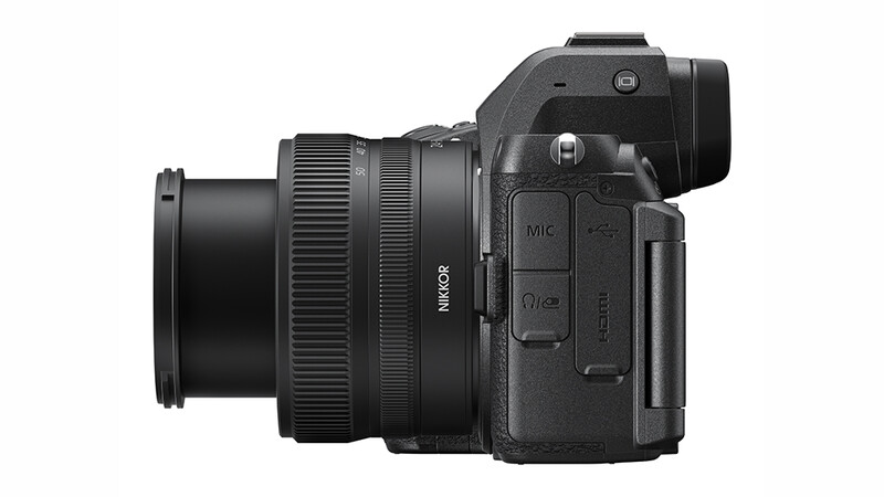 Nikon Z mirrorless camera with attached zoom lens, shown from the right side profile against a white background.